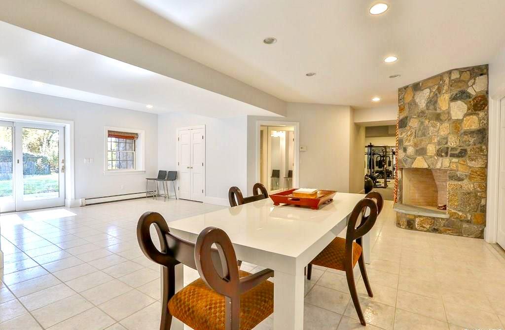 28 A Wrights Mill Road Armonk, NY 10504 - Photo 28 of 33 Lower level recreation room with doors out to patio and pool