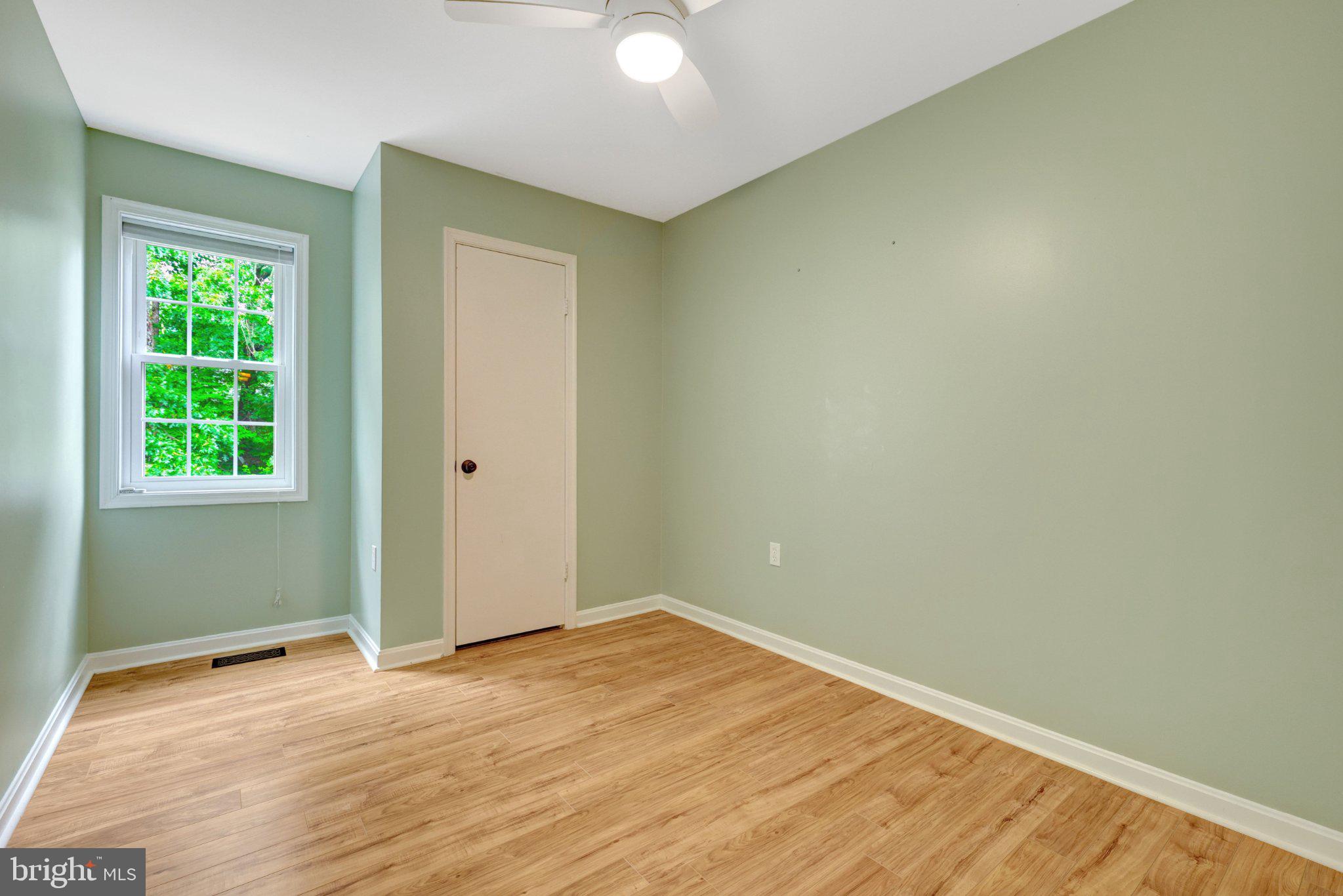 11992 Sentinel Point Court Reston, VA 20191 - Photo 26 of 36 2nd bedroom with ceiling fan w/ light