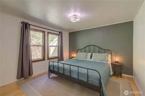 a bedroom with a bed and a window