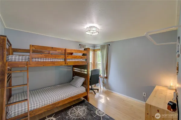 a bedroom with furniture and a window