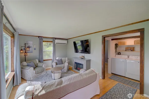 a living room with furniture and a flat screen tv