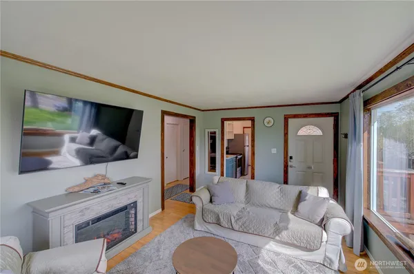 a living room with furniture and a flat screen tv