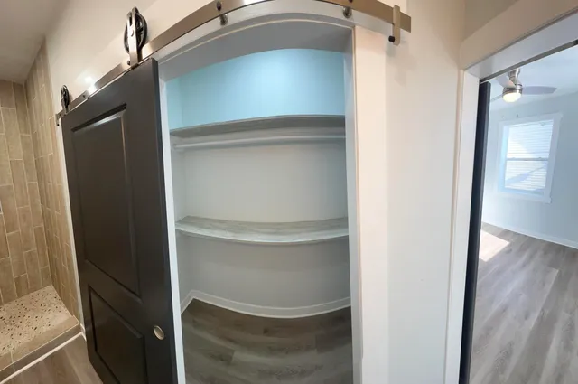 a bathroom with a glass shower door