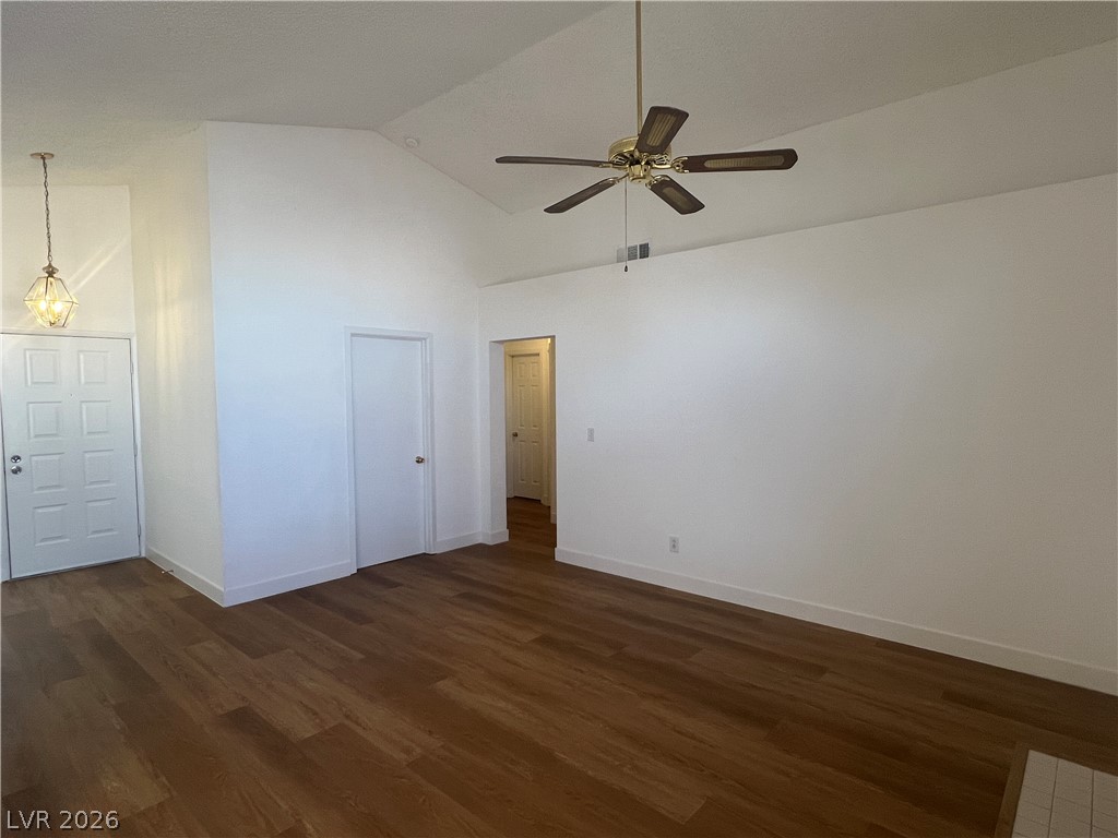 1309 Goldenglow Road Las Vegas, NV 89108 - Photo 5 of 11 Vast interior volume with high ceilings and warm wood flooring.