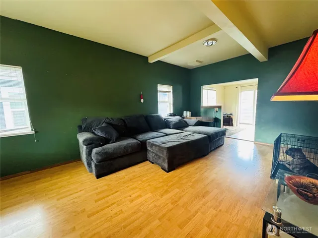 a spacious bedroom with a bed window and table