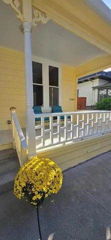 a bed sitting in a room next to a large window