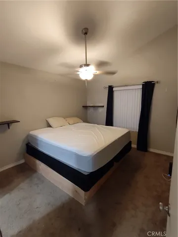 a kitchen with a refrigerator and a stove top oven