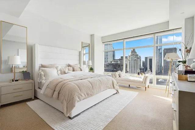 a living room with fireplace furniture and a chandelier