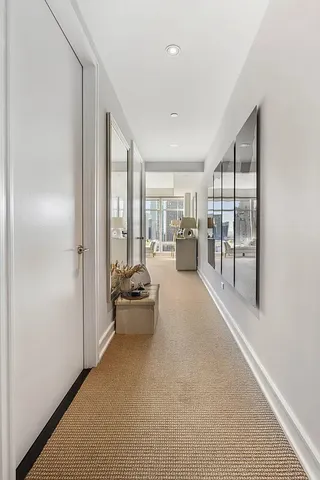 a bedroom with a large bed and a large window