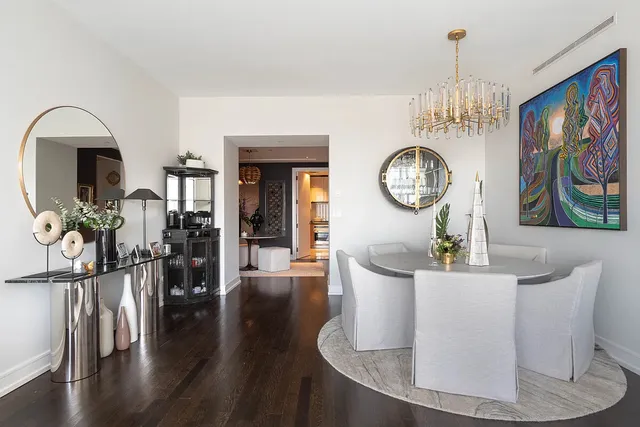 a living room with furniture and large window