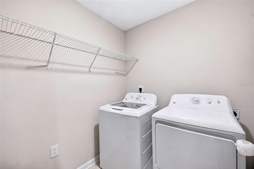 31724 Sun Kettle Loop Wesley Chapel, FL 33545 - Photo 40 of 49 a utility room with dryer and washer