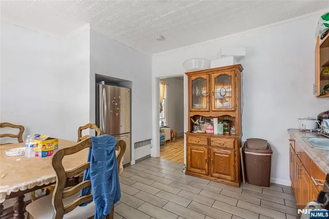 a view of a workspace with furniture and wooden floor
