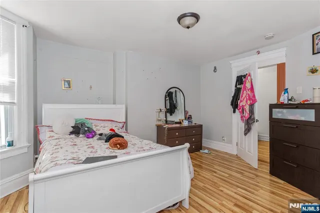 a kitchen view with wooden floor washer and dryer