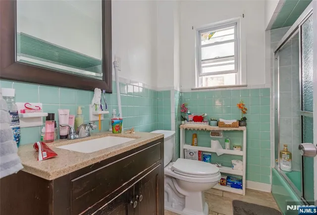 a room with a washing machine and sink