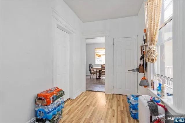 a view of an entryway with wooden floor