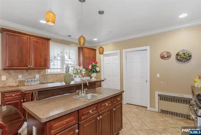 a kitchen with a sink and cabinets