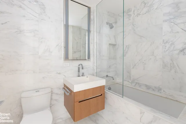 a bathroom with a sink and toilet