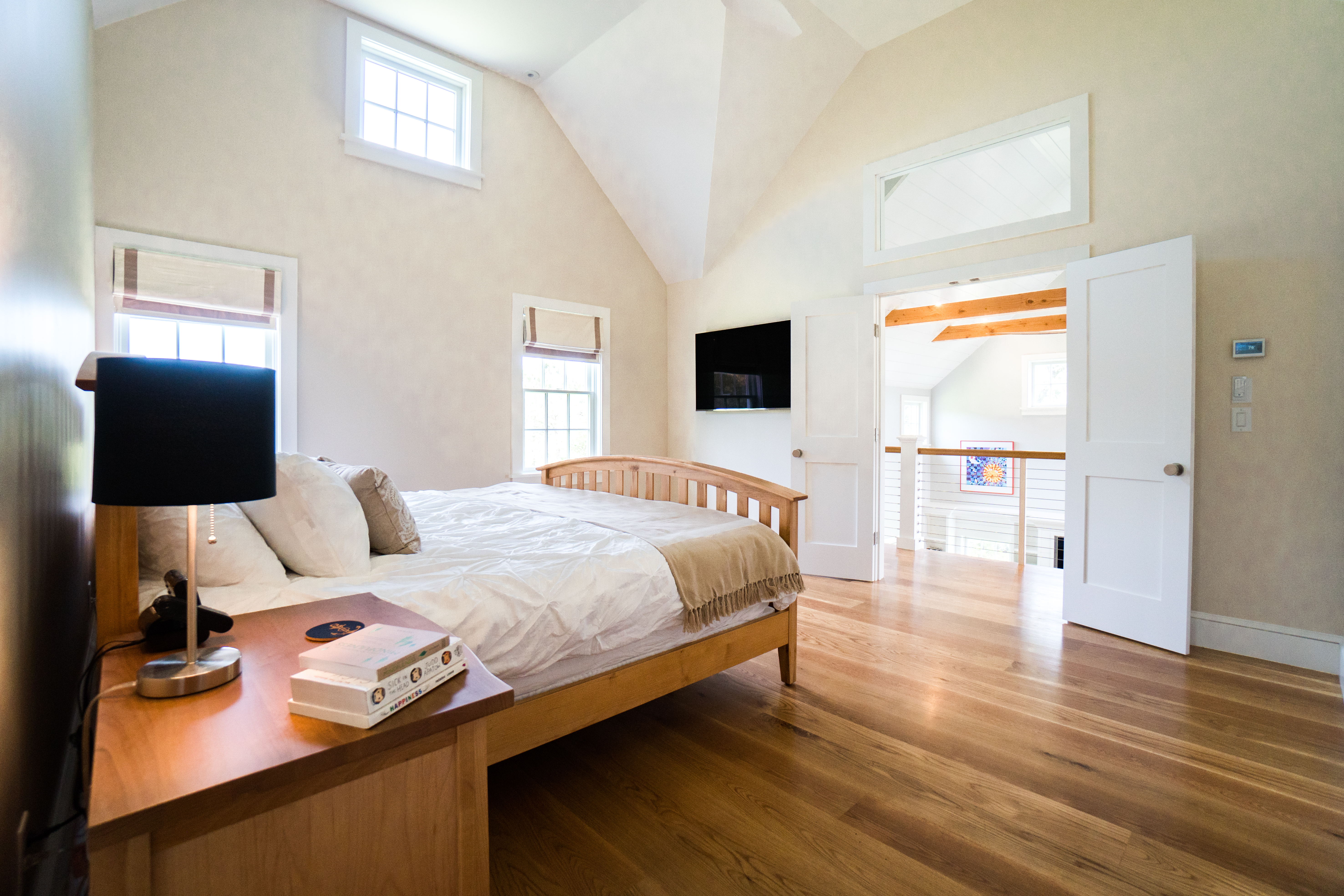 50 Lovers Lane Nantucket, MA 02554 - Photo 18 of 34 a bedroom with a bed and wooden floor