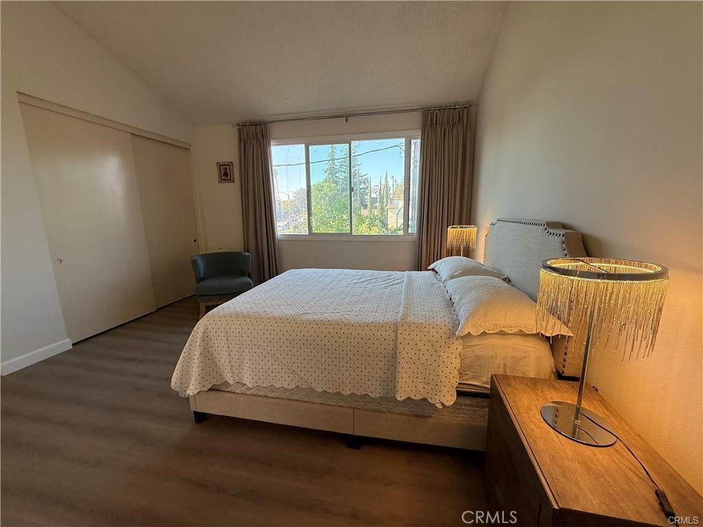 415 West Duarte Road Arcadia, CA 91007 - Photo 12 of 14 a bed sitting in a bedroom next to a window