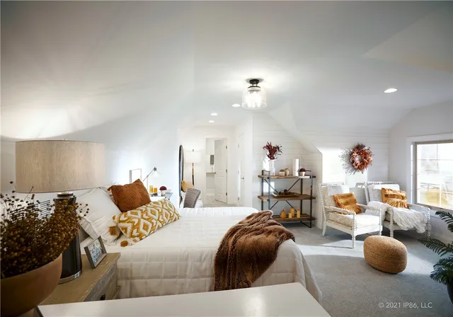 a bedroom with furniture and a chandelier