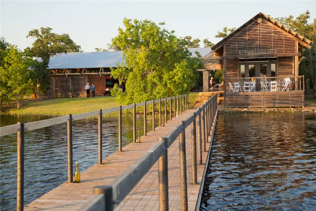 a balcony with table and chairs