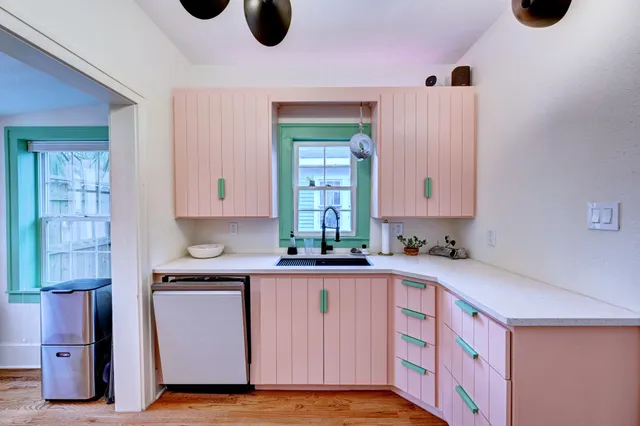 a kitchen with a cabinets and window