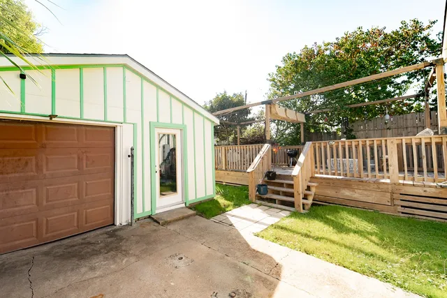 a view of a balcony with two chairs and a table