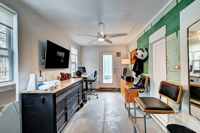 a view of a patio with couches table and chairs and potted plants