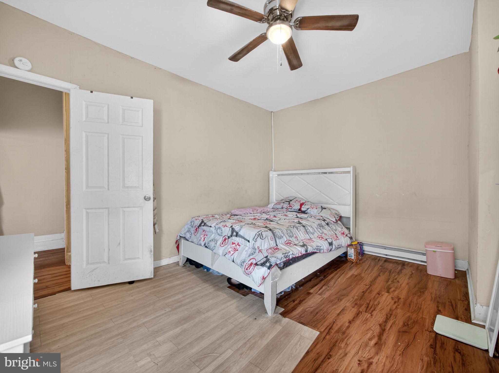 866 East High Street Pottstown, PA 19464 - Photo 35 of 45 Cozy bedroom with warm wood tones.