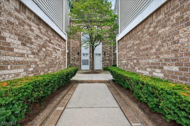 a view of a house with potted plants