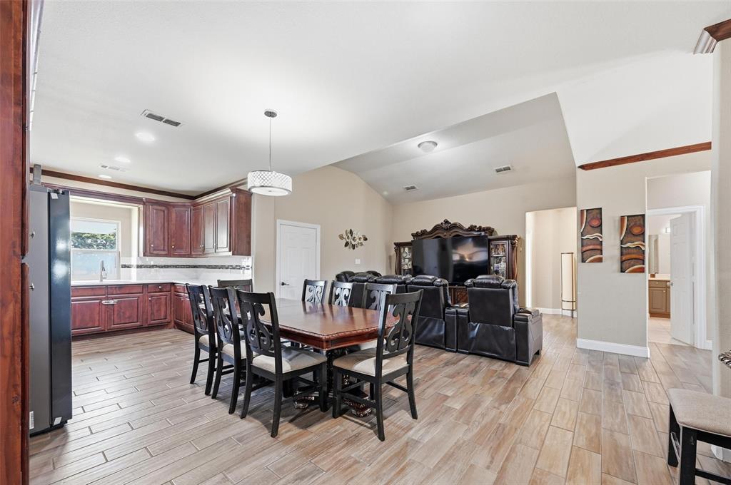 559 Northstar Road Fate, TX 75189 - Photo 15 of 32 a view of a dining room with furniture and wooden floor