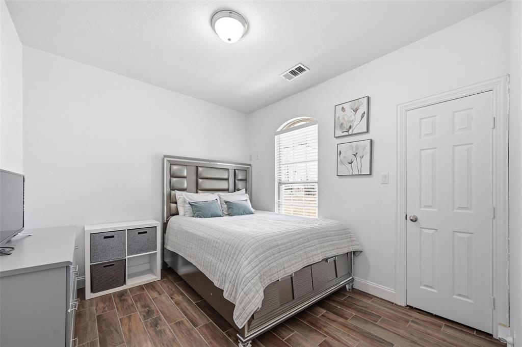 559 Northstar Road Fate, TX 75189 - Photo 25 of 32 a bedroom with a bed and a window