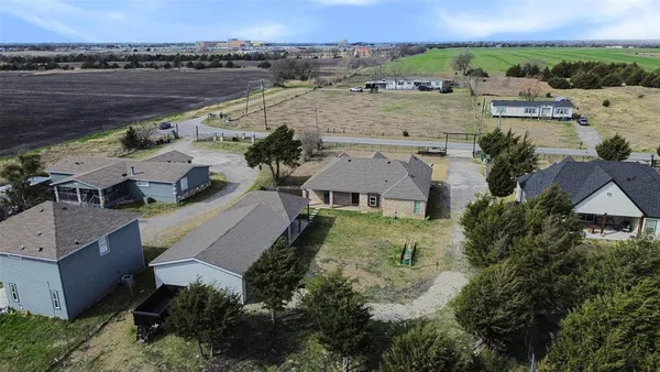 an aerial view of a house with a garden