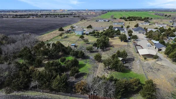 an aerial view of a houses with a lake view
