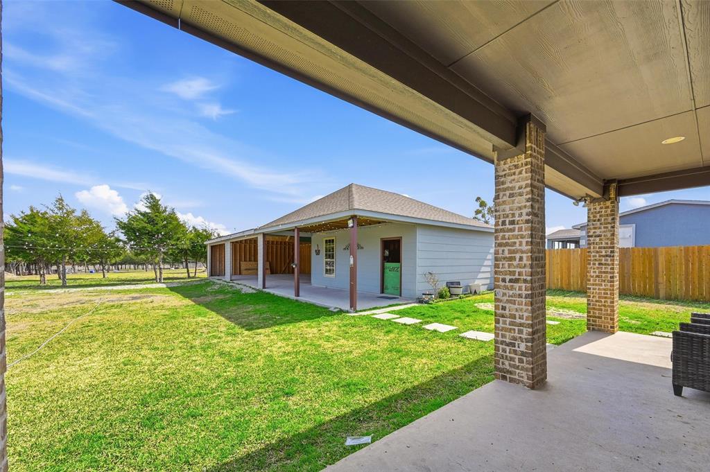 559 Northstar Road Fate, TX 75189 - Photo 4 of 32 a front view of a house with garden