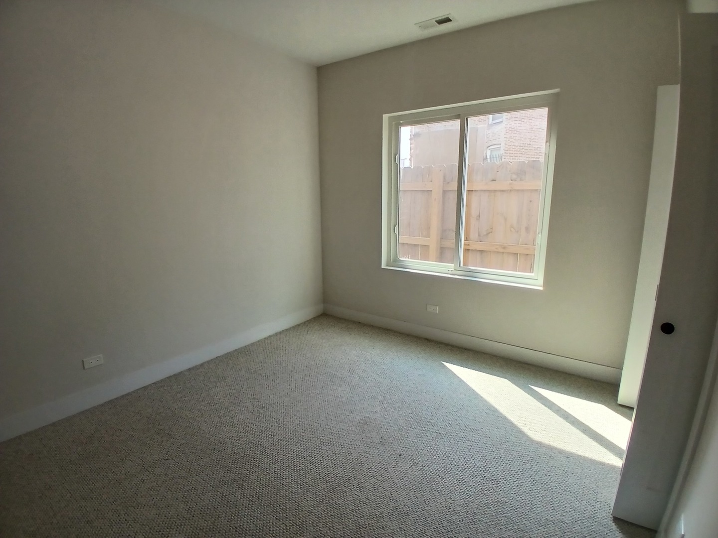 4608 South Indiana Avenue, Unit 1 Chicago, IL 60653 - Photo 12 of 24 an empty room with a window