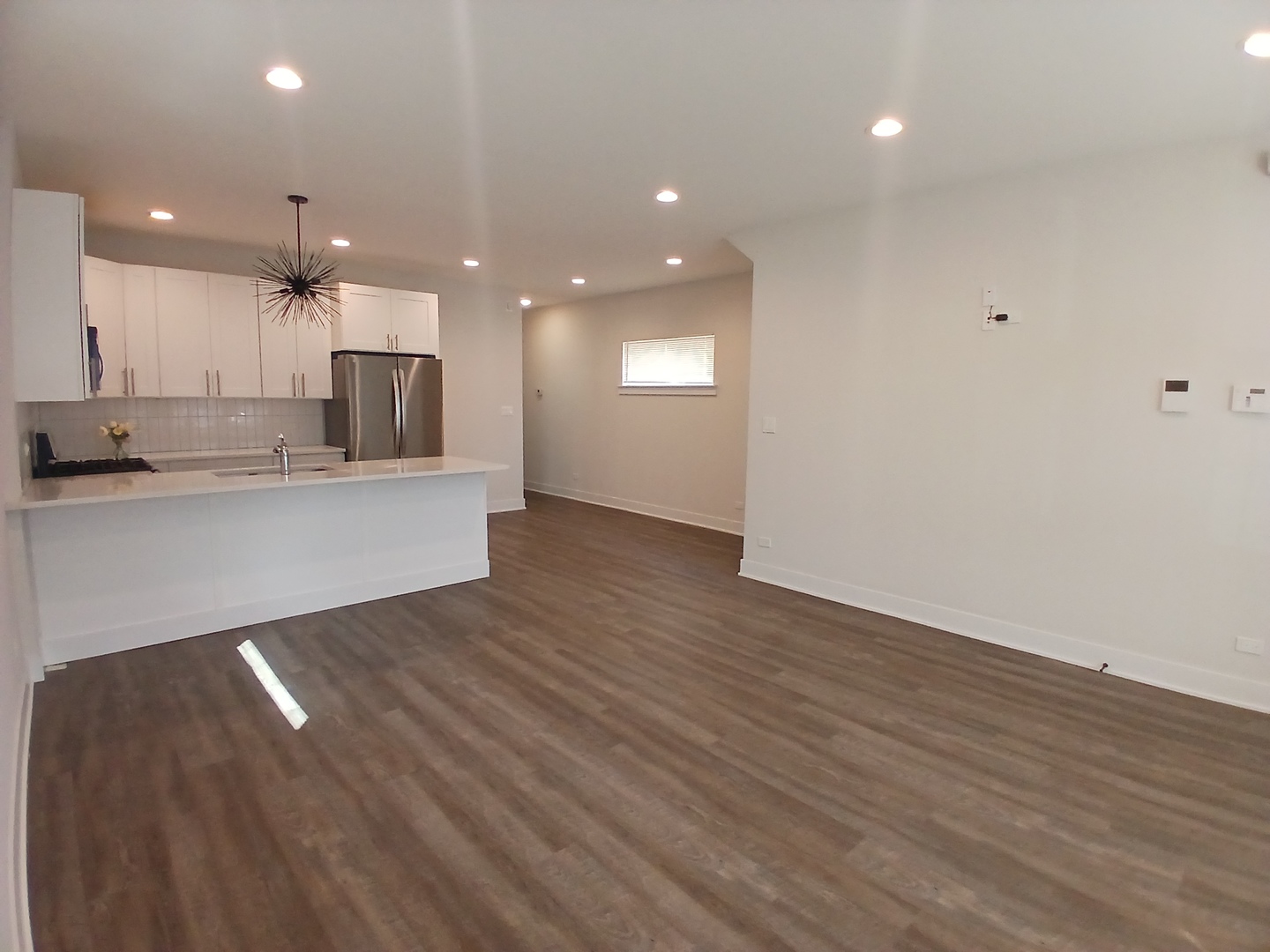 4608 South Indiana Avenue, Unit 1 Chicago, IL 60653 - Photo 5 of 24 a view of kitchen with sink and wooden floor