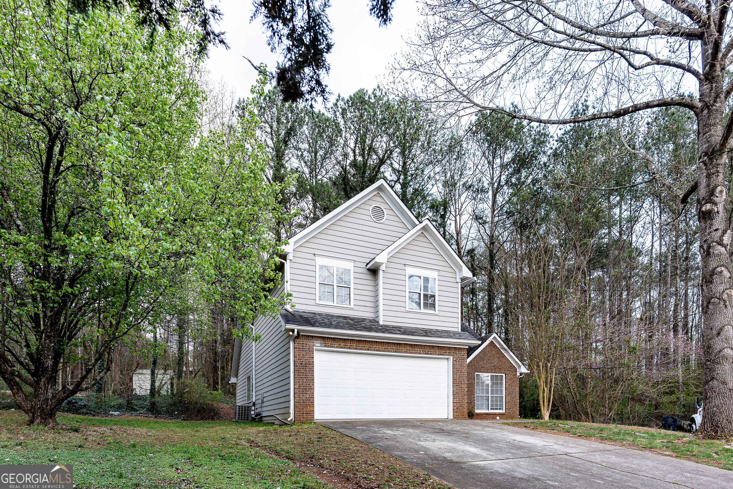 3821 Rex Mill Square Rex, GA 30273 - Photo 2 of 68 a front view of a house with a yard and garage