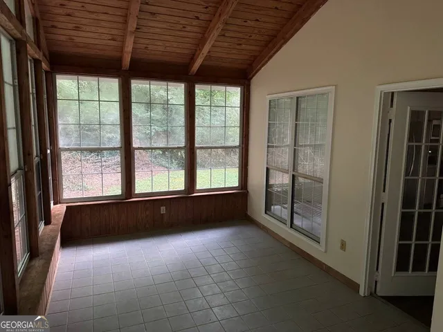 a view of a kitchen with wooden floor and a sink