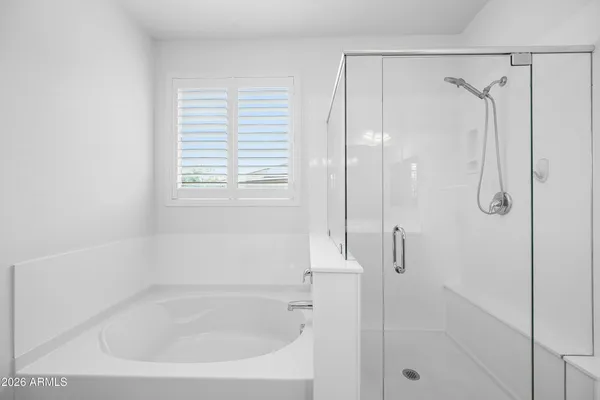 a bathroom with a shower and a bathtub