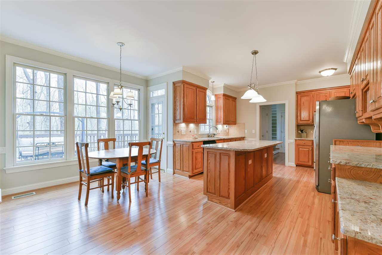 6017 Glenthorne Drive Raleigh, NC 27613 - Photo 3 of 13 Light filled breakfast room and kitchen opens a large family room which offers a gas FP and plenty of windows for natural lighting. Breakfast Area