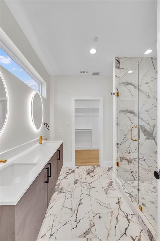 2214 Annex Avenue, Unit 106 Dallas, TX 75204 - Photo 15 of 19 a bathroom with a sink mirror and shower