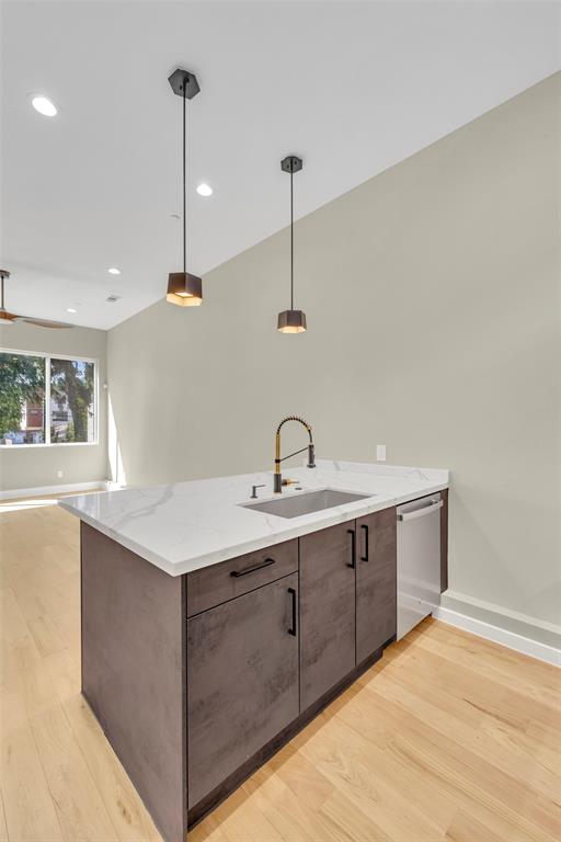 2214 Annex Avenue, Unit 106 Dallas, TX 75204 - Photo 10 of 19 a kitchen with a sink and window