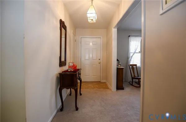 a room with a mirror and a window