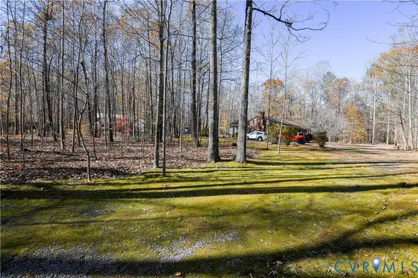 a view of swimming pool with outdoor seating and yard
