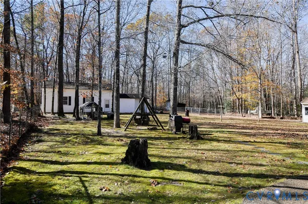 a view of swimming pool with a yard
