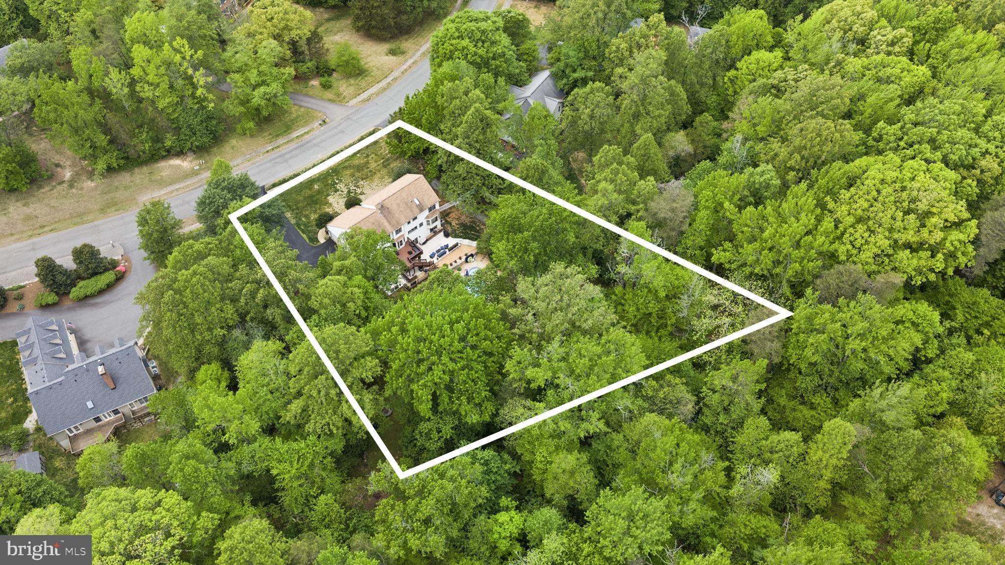 100 Boscobel Road Fredericksburg, VA 22405 - Photo 66 of 67 a backyard of a house with lots of green space and trees all around