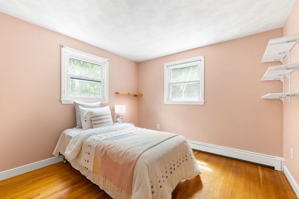 21 Vanderbelt Road Acton, MA 01720 - Photo 22 of 36 a bedroom with a bed and a window