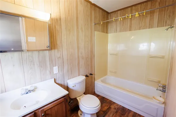 wooden floor in a room with a window