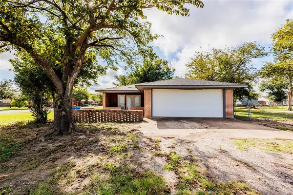 a view of a park with large trees